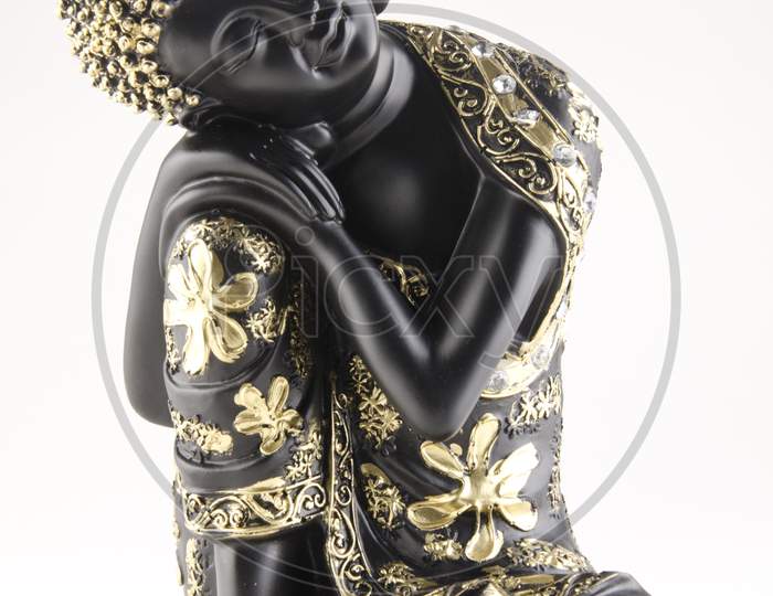 Budda Idol Or Figurine  Over An Isolated White Background