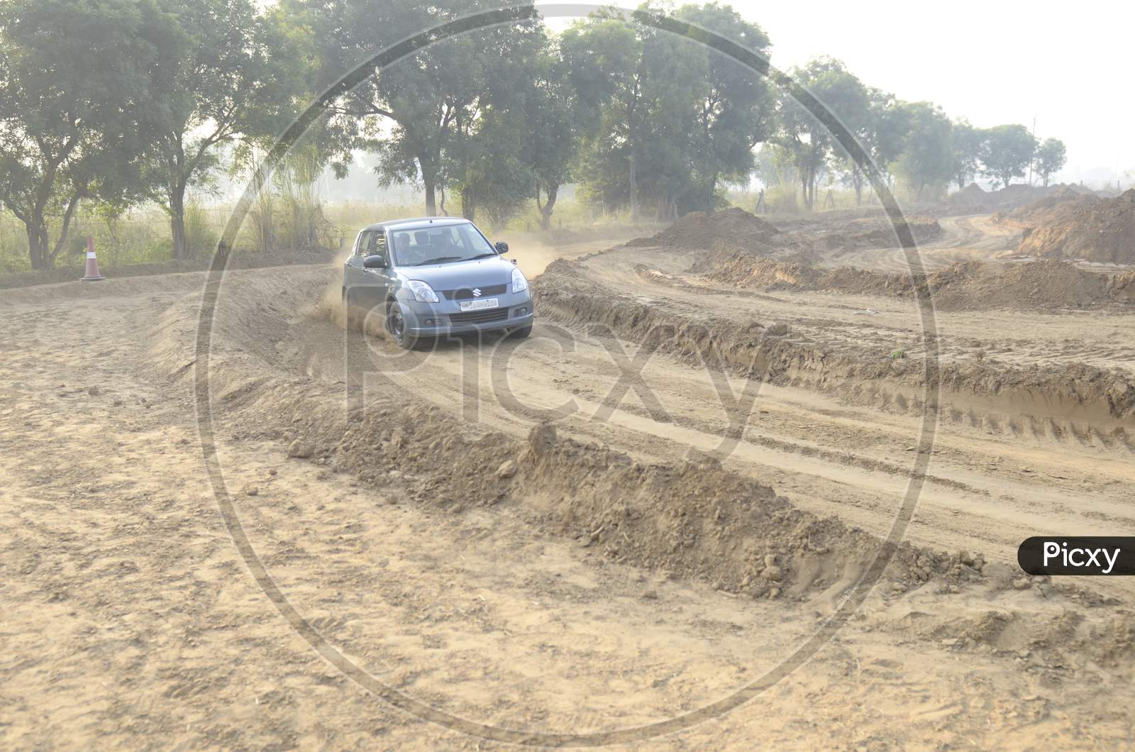 Maruthi Suzuki Swift  Car Or  Off-Road Vehicle  in an Rally Championship  With Drifting And Sand and Soil  Splashes on Rally Tracks