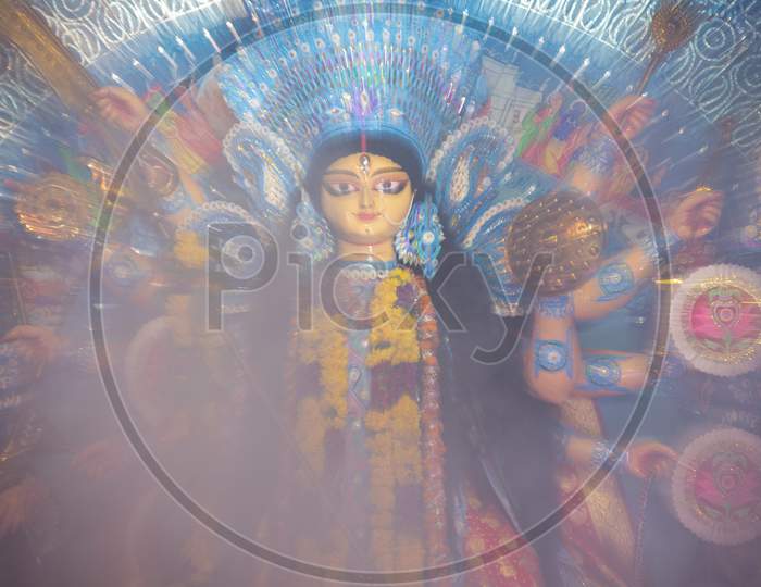 Goddess Durga Devi Statue covered in smoke during Dussehra