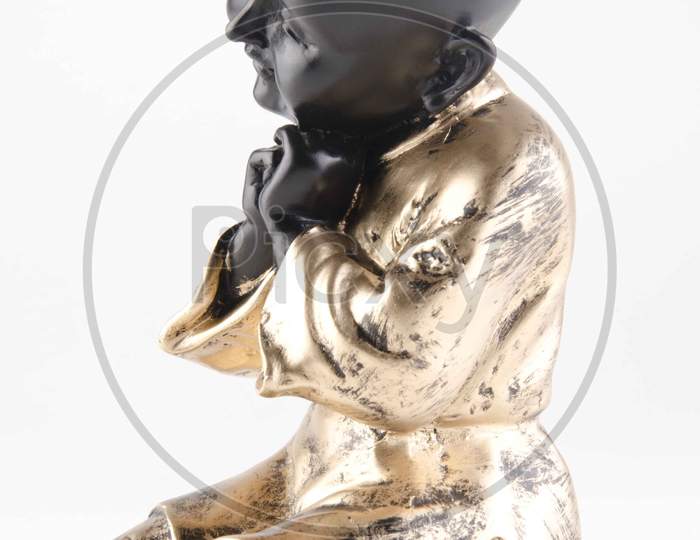 Chinese Boy Figurine Over An Isolated White Background