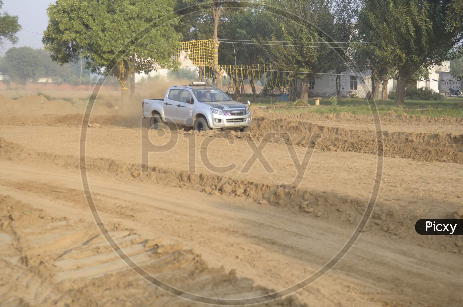 View of Isuzu Maxo taking a turn during rally race