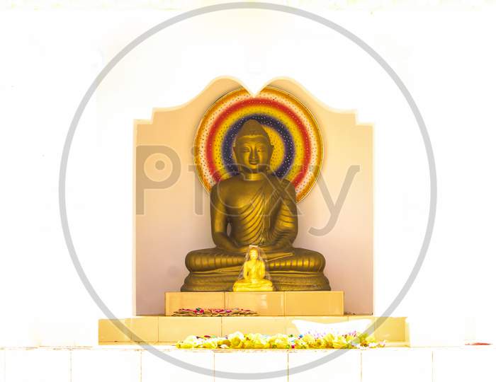 golden buddha statue with white background