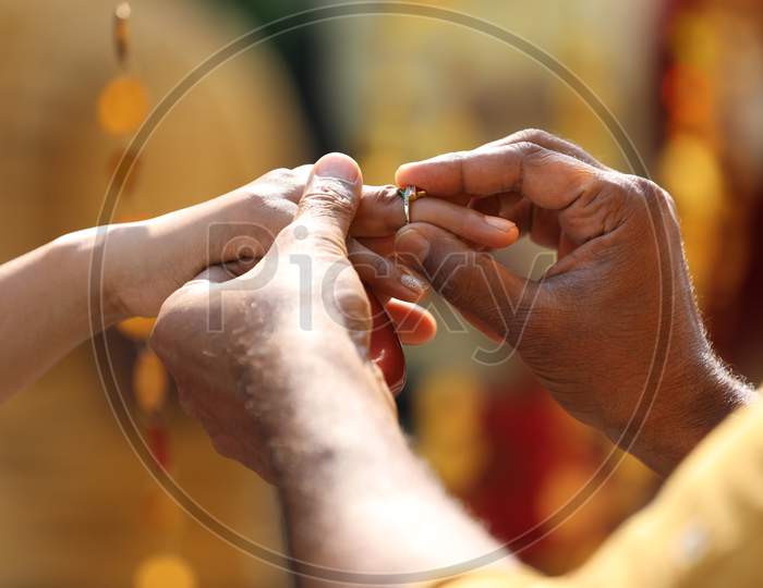 Couple Exchanging Couple Rings Hands Closeup