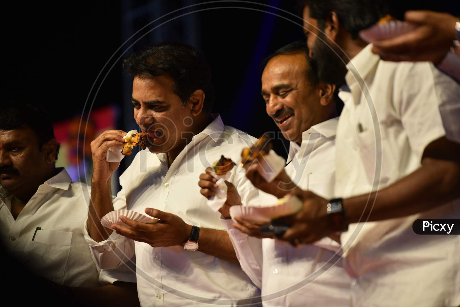 Telangana Cabinet Ministers KTR,Etela Rajender, V Srinivas Goud eating chicken in a Public Meeting