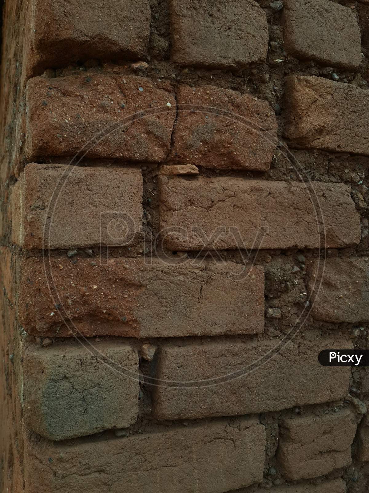 Brick and soil wall