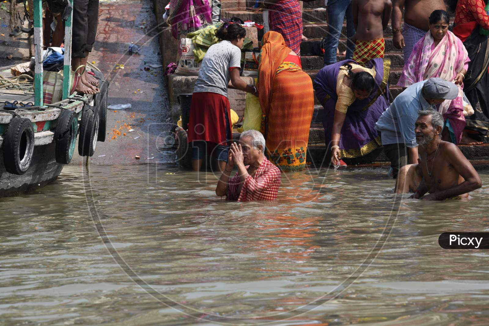 Hindu Devotees Taking Bath  in Hooghly River  at  Ghats Near Dakshineshwar Kali Temple  in Kolkata