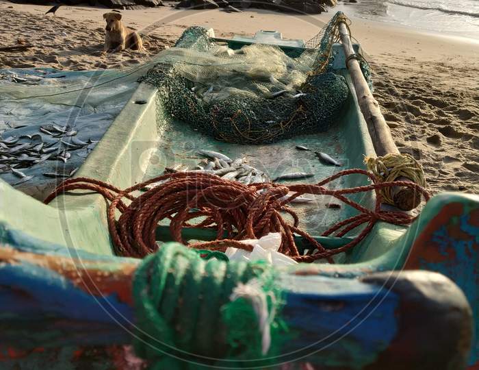 Fishing Boat With Nets And Thread Knots At Pondicherry Beach