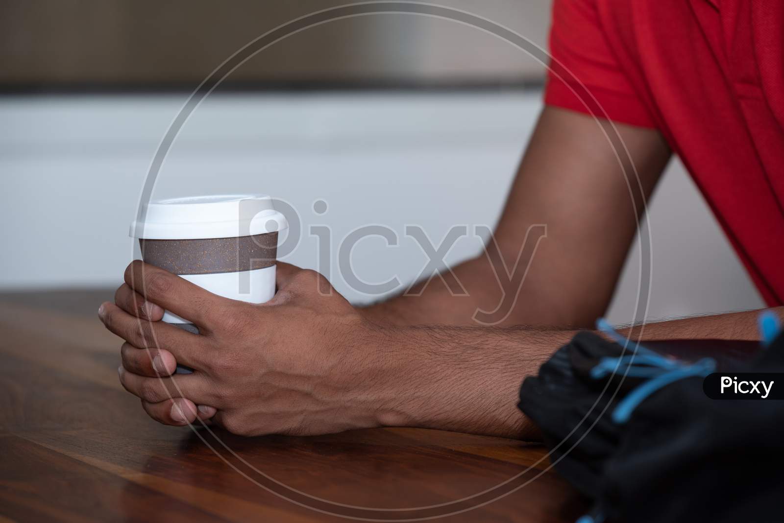 Indian Male Student With a Coffee Cup , Closeup Of Hands
