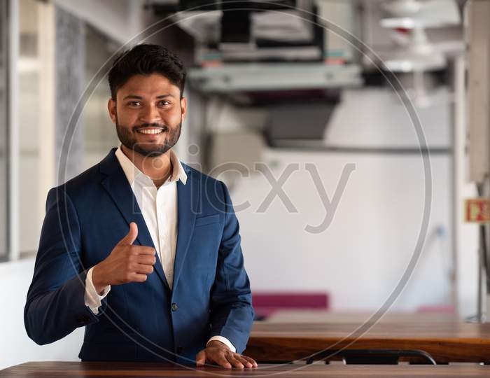 Indian Successful Businessman With Smile Face In an Office