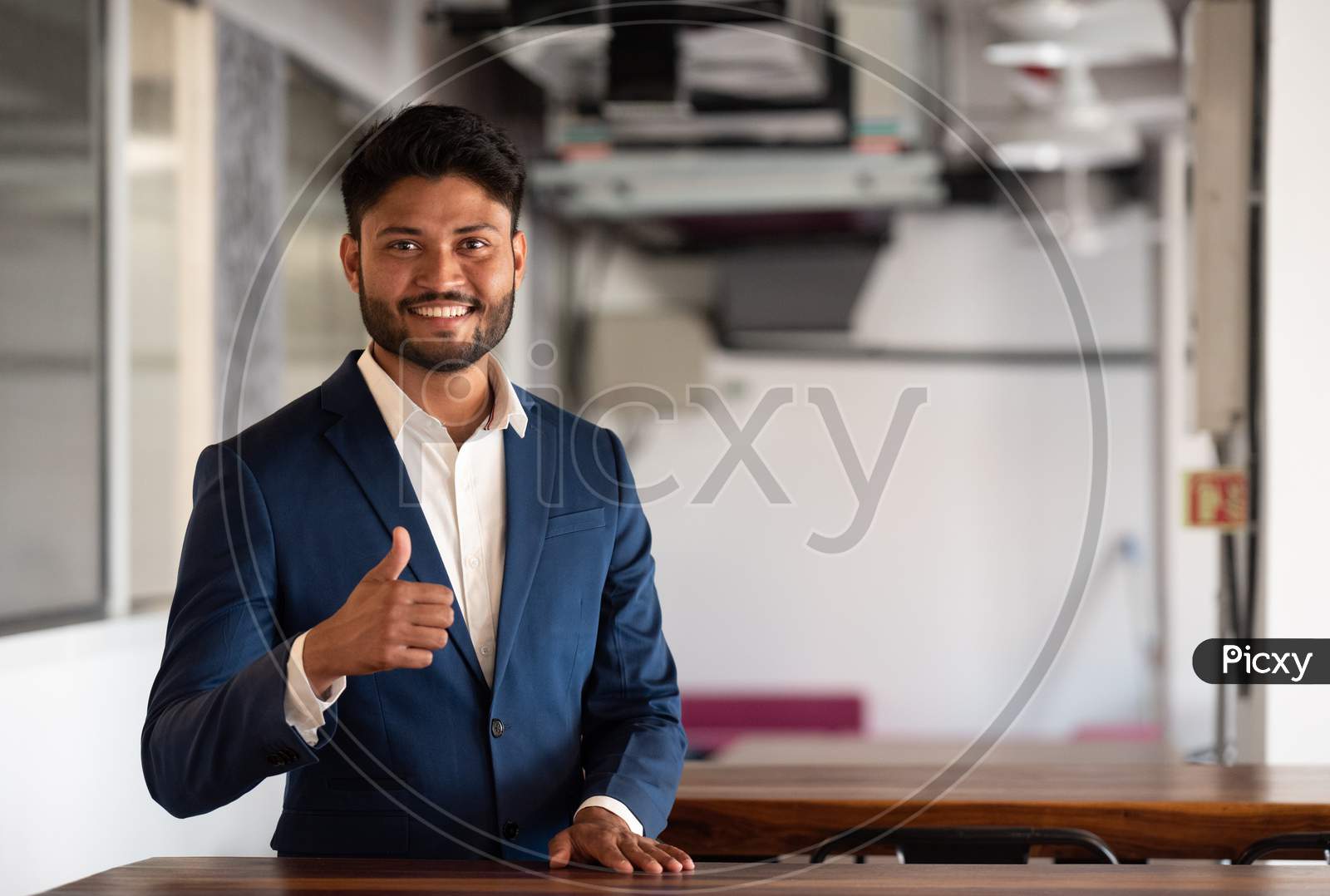Indian Successful Businessman With Smile Face In an Office
