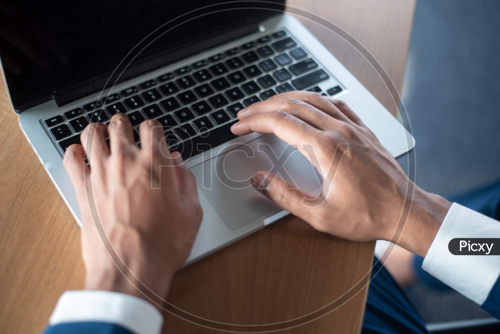 Indian Businessman Using Laptop At an Office Desk  Hands Closeup