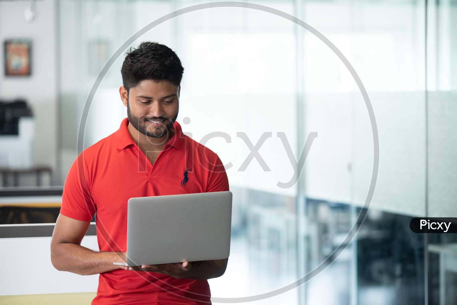 Indian Male Businessman  Working On Laptop At an Office Indoor