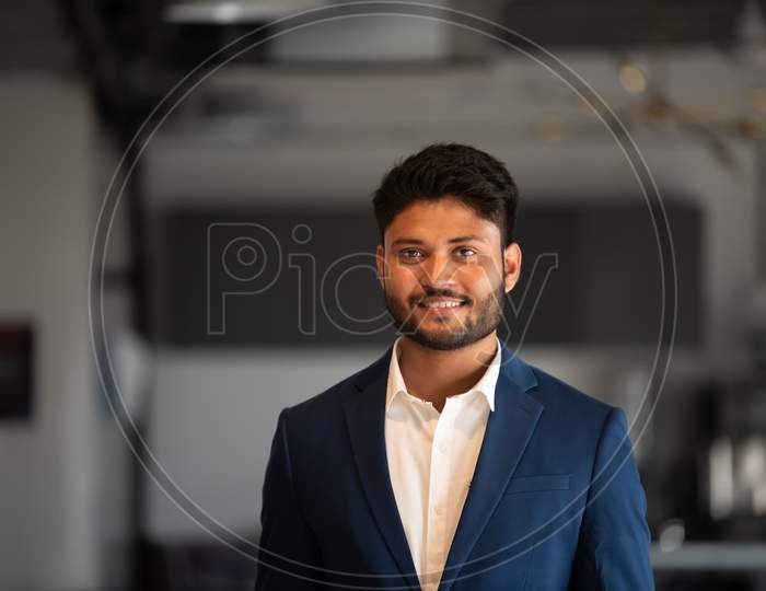 Indian Businessman With Smile Face Standing at an Office in Suite