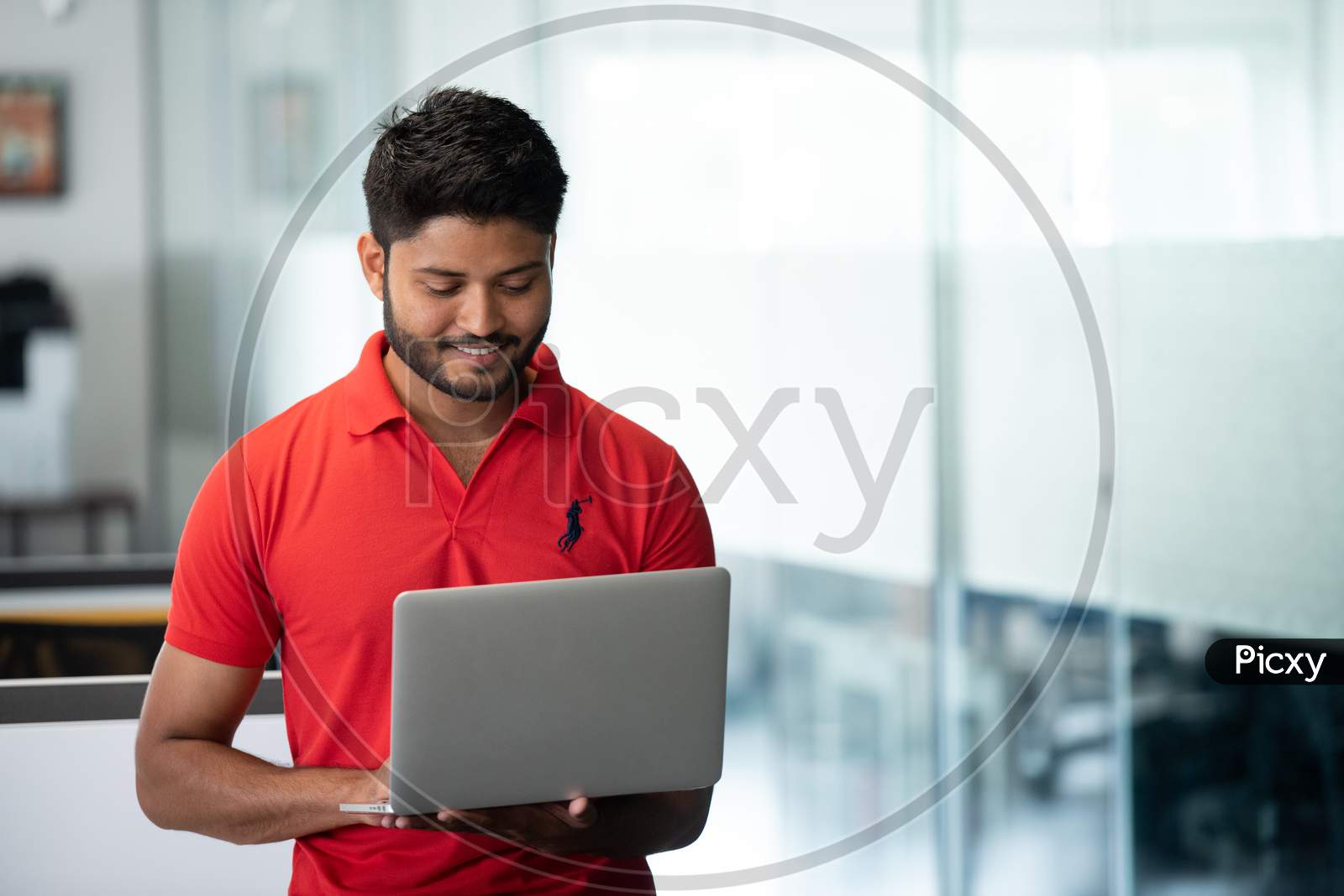 Indian Male Businessman  Working On Laptop At an Office Indoor
