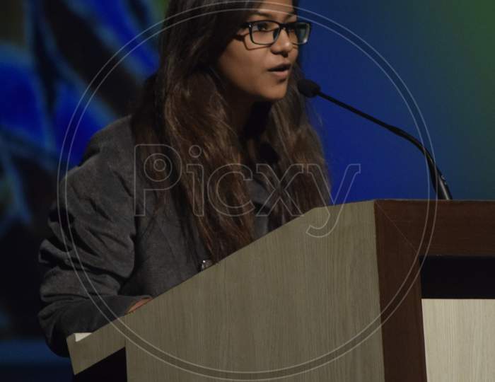 A Student speaking at the podium