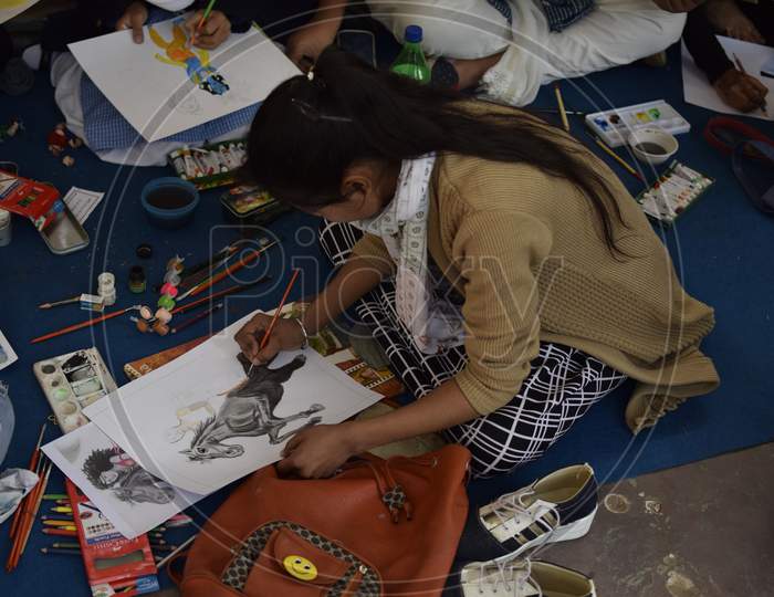 Indian Student sketching a horse during art class