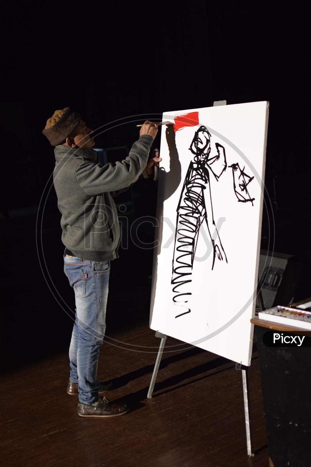 An artist performing live sketch