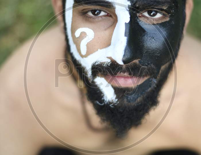 Indian Male Model with black and white face paint