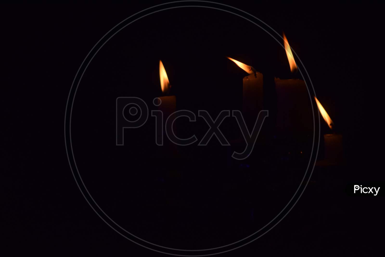 Candles lighted  over a dark background