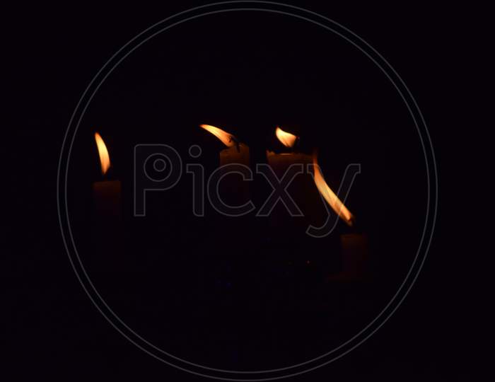 Candles lighted  over a dark background