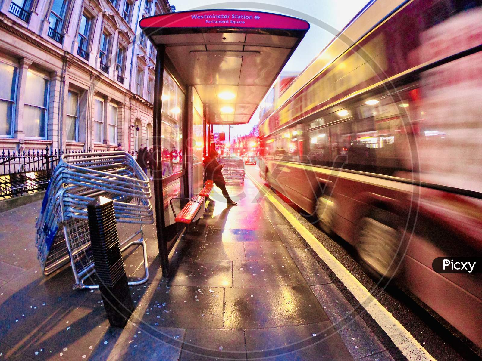 A Commuter Waiting At an Tram Stop In London City