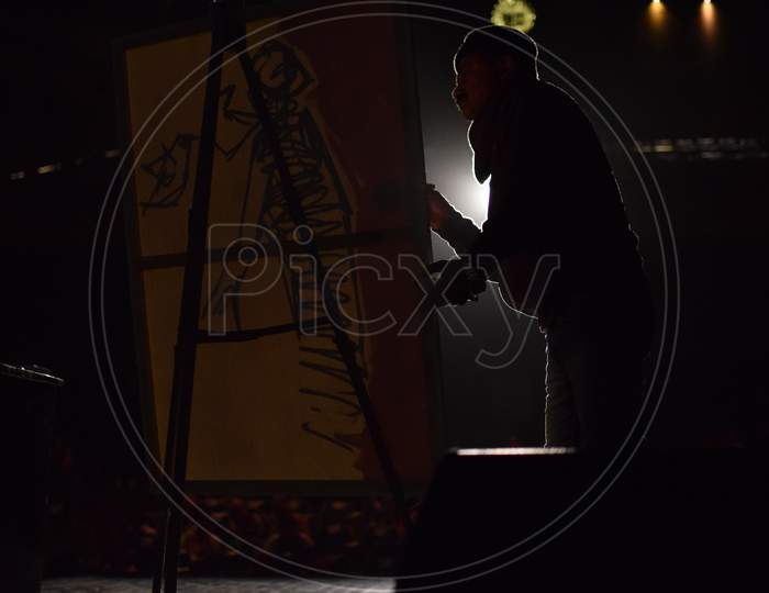 An artist sketching abstract painting on the stage