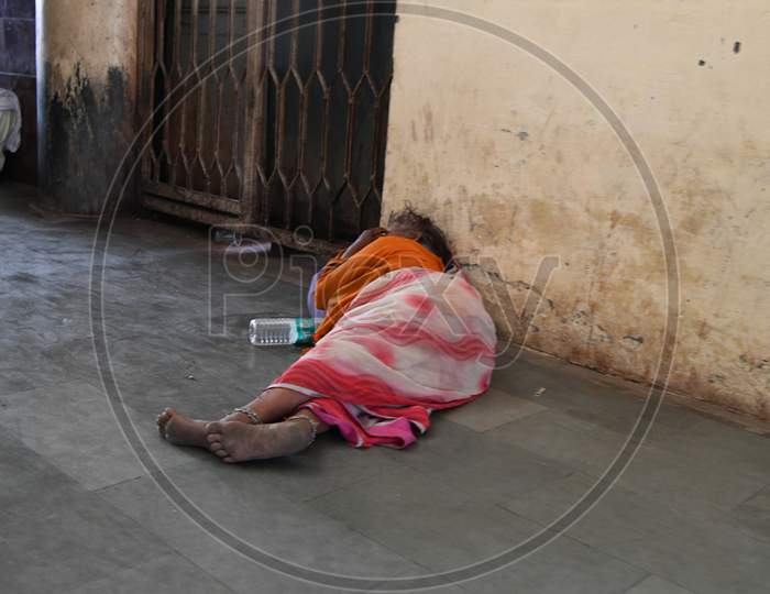 Indian Passengers Waiting And Sleeping On Railway Station Platform