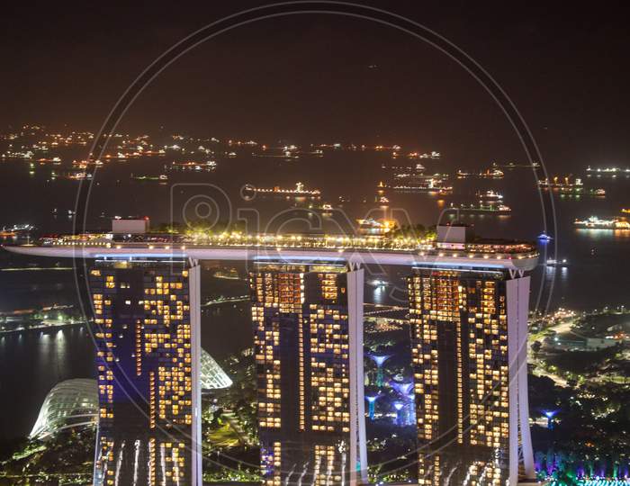 Marina City Park With Tower In Night Lights At Marina Bay, Singapore