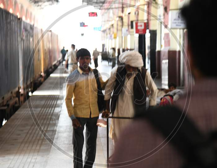 Passengers Waiting On an Railway Station Platform