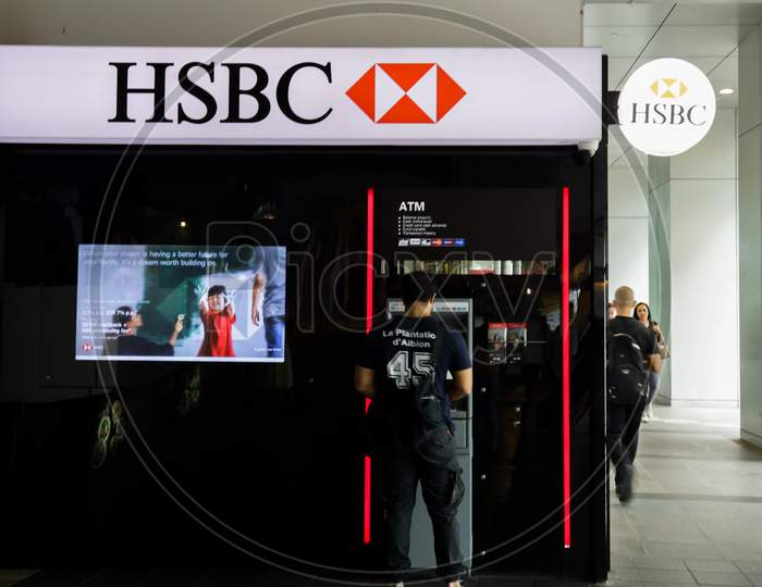 HSBC Bank ATM With A Man  Using The ATM Machine