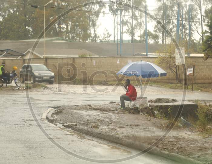 A man sitting by the road in Kenya