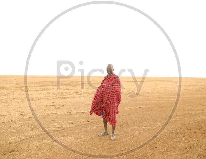 A Lonely Kenya Man standing in red dress