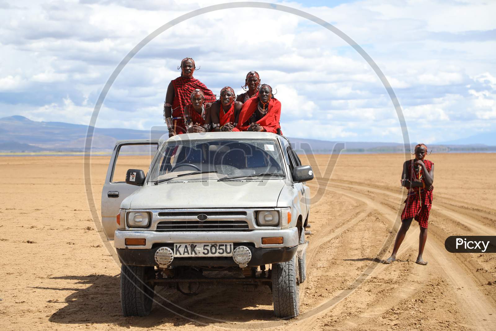A Group of Tribal Kenya Men in a car