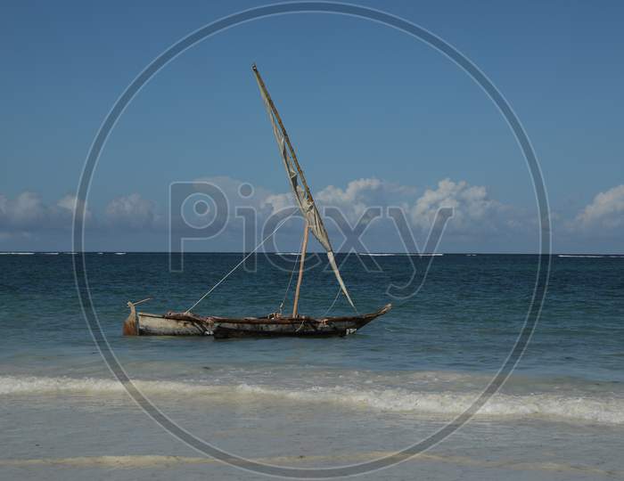 A Lone Boat At an Beach