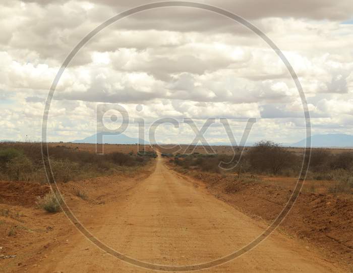 An empty muddy roadway in Kenya