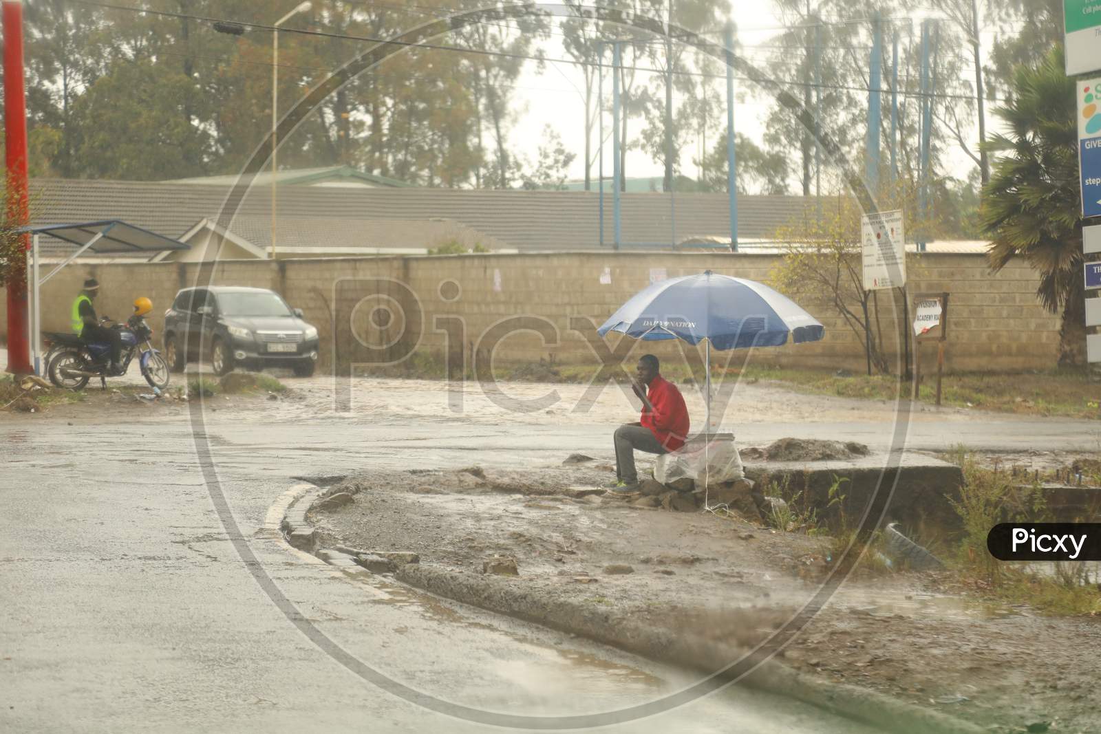 A man sitting by the road in Kenya