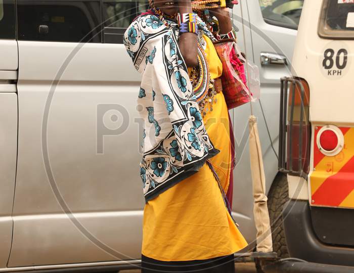 A Nigerian Tribal woman rubbing her eyes