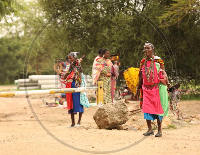 Tribal Women waiting by the road
