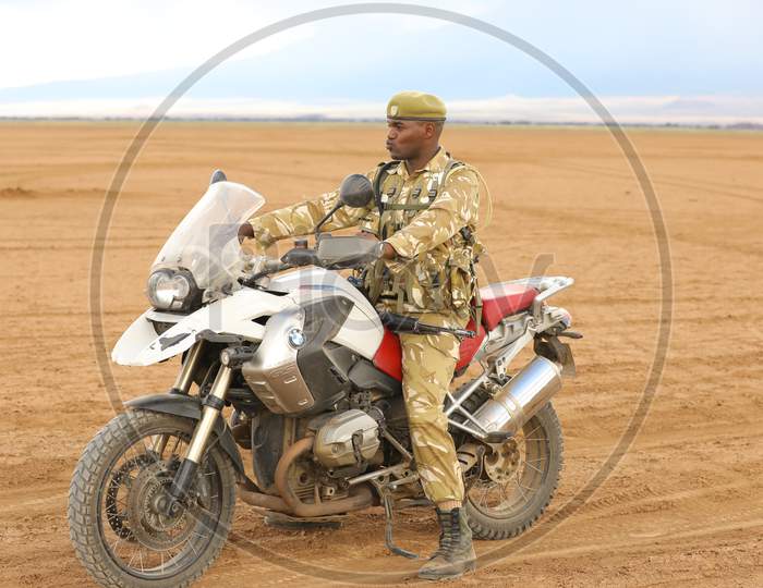 Masai Mara Ranger Siting on Bike