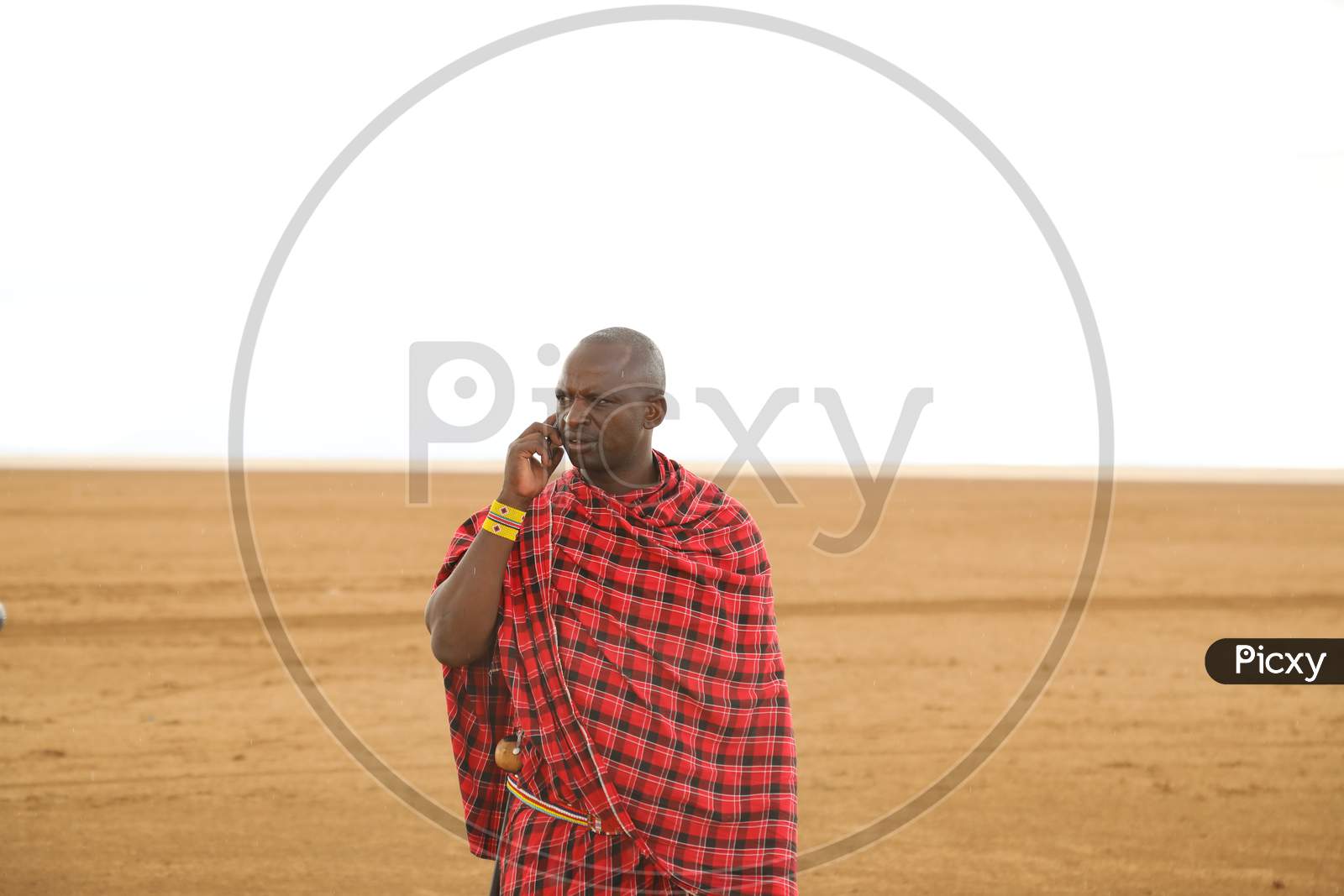 A Kenya man speaking on the phone