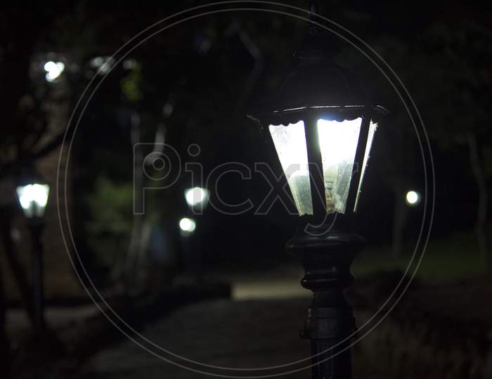 A Lamp Post in an Lane With Night Dark Background
