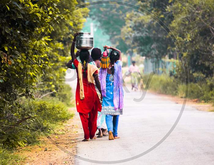 Indian Rural Village Girls Carrying Water Vessels on Head