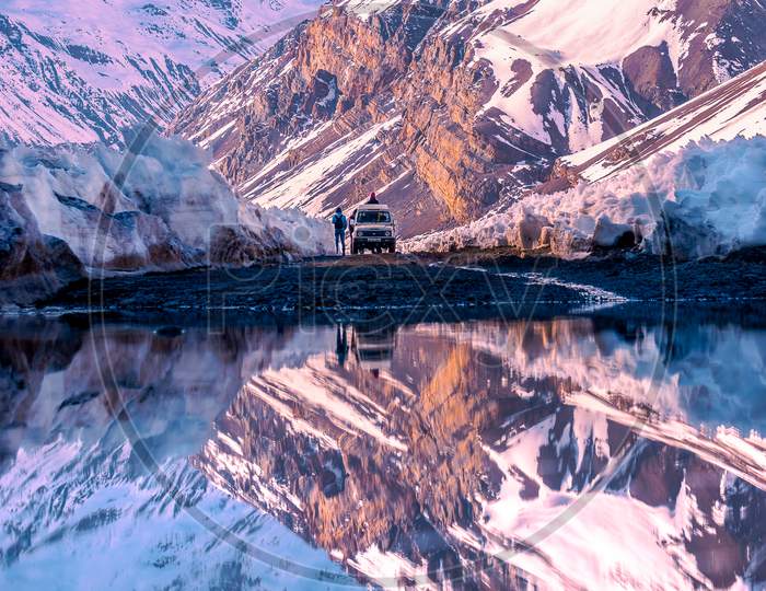 Reflection Of Mountain Ranges On Lake Water In Leh