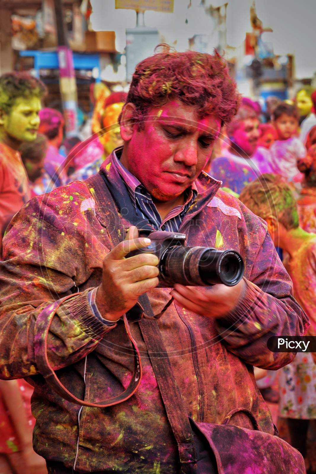 Photographer in holi celebrations. 