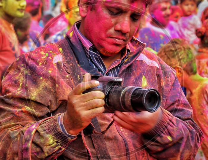 Photographer in holi celebrations. 