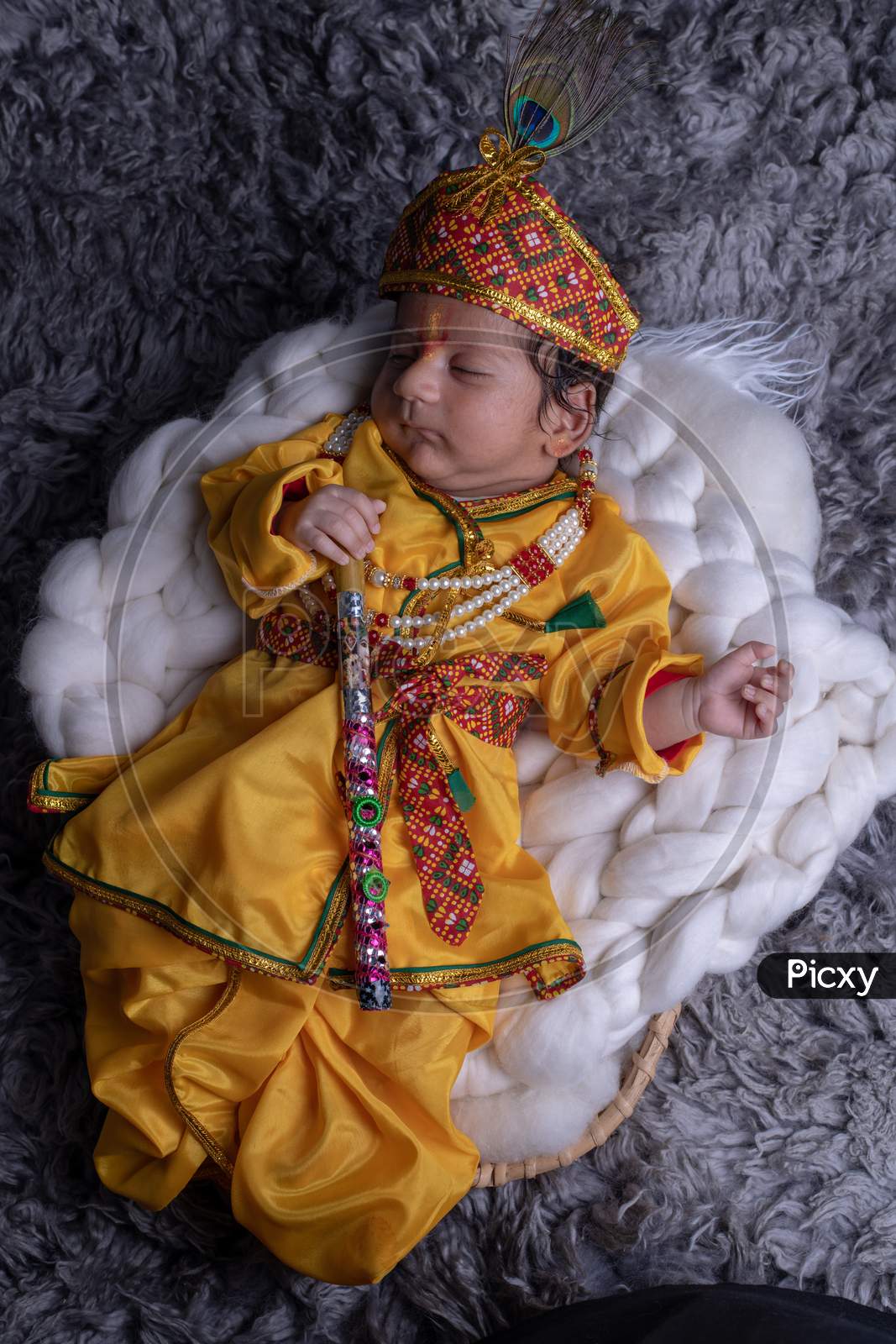Image of Cute Little Baby In Lord Sri Krishna Clothes Sleeping ...