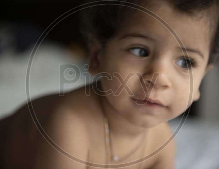 Cute Baby Girl Playing in a House with Smile Face