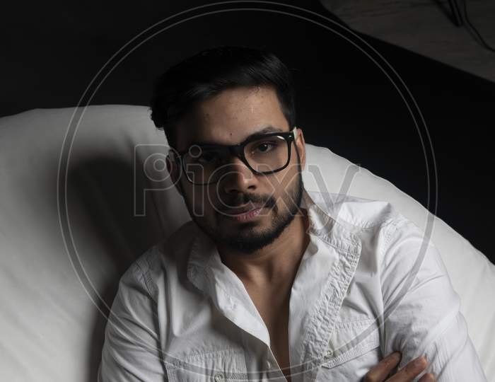 Portrait of Attractive Indian Male Model Wearing Spectacles And Posing In an Shoot