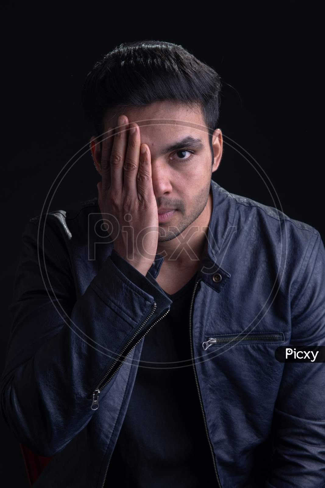 Indian boys giving poses for fashion photo shoot on studio with using  specs, headphone, light bulb props Stock Photo - Alamy