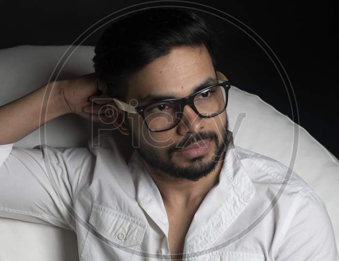 Portrait of Attractive Indian Male Model Wearing Spectacles And Posing In an Shoot